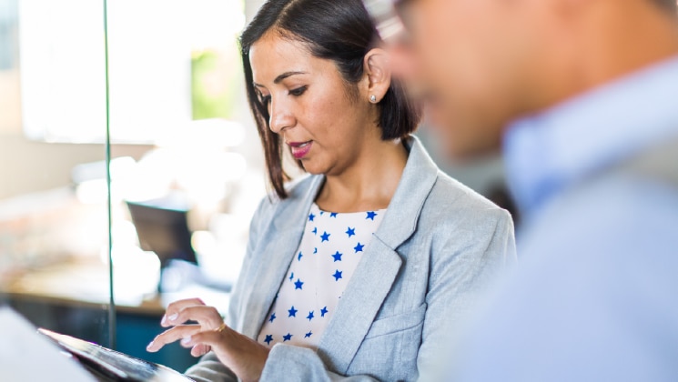 Female reviewing files in meeting