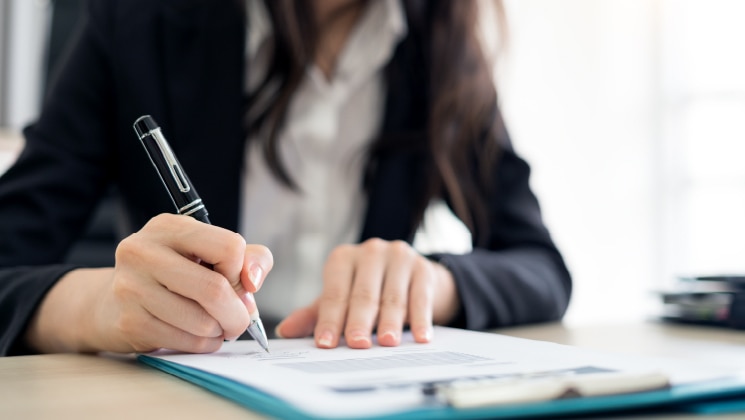 Woman completing paperwork